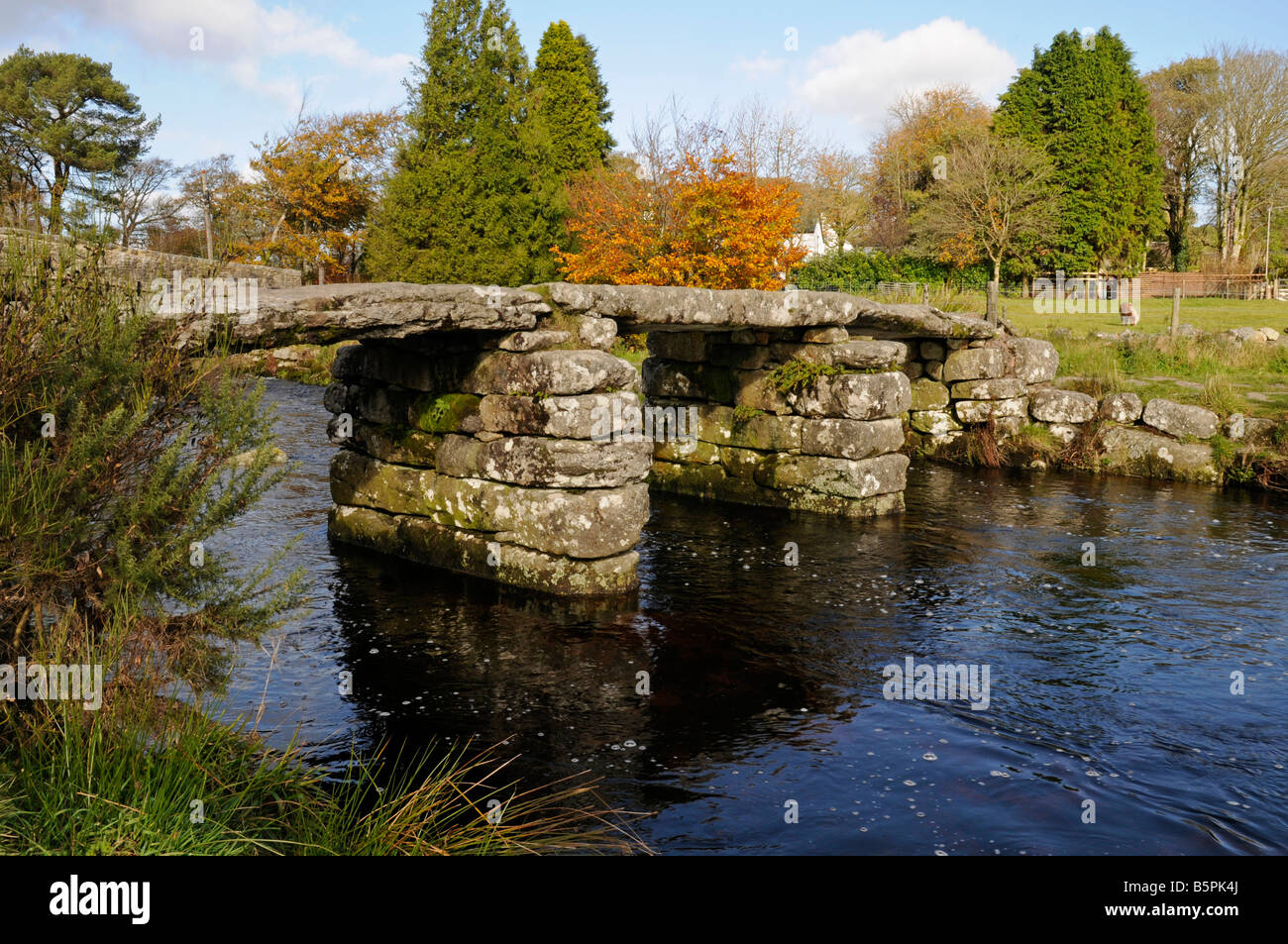 Ancient Clapper bridge across the East Dart River at Two Bridges ...