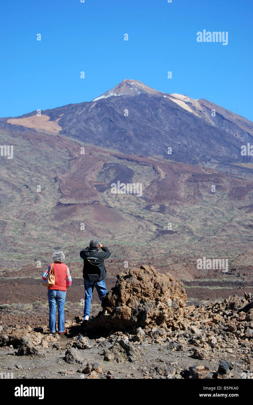View of Mt.Teide across lava fields, from lookout point, Parque Nacional Del Teide, Tenerife, Canary Islands, Spain Stock Photo