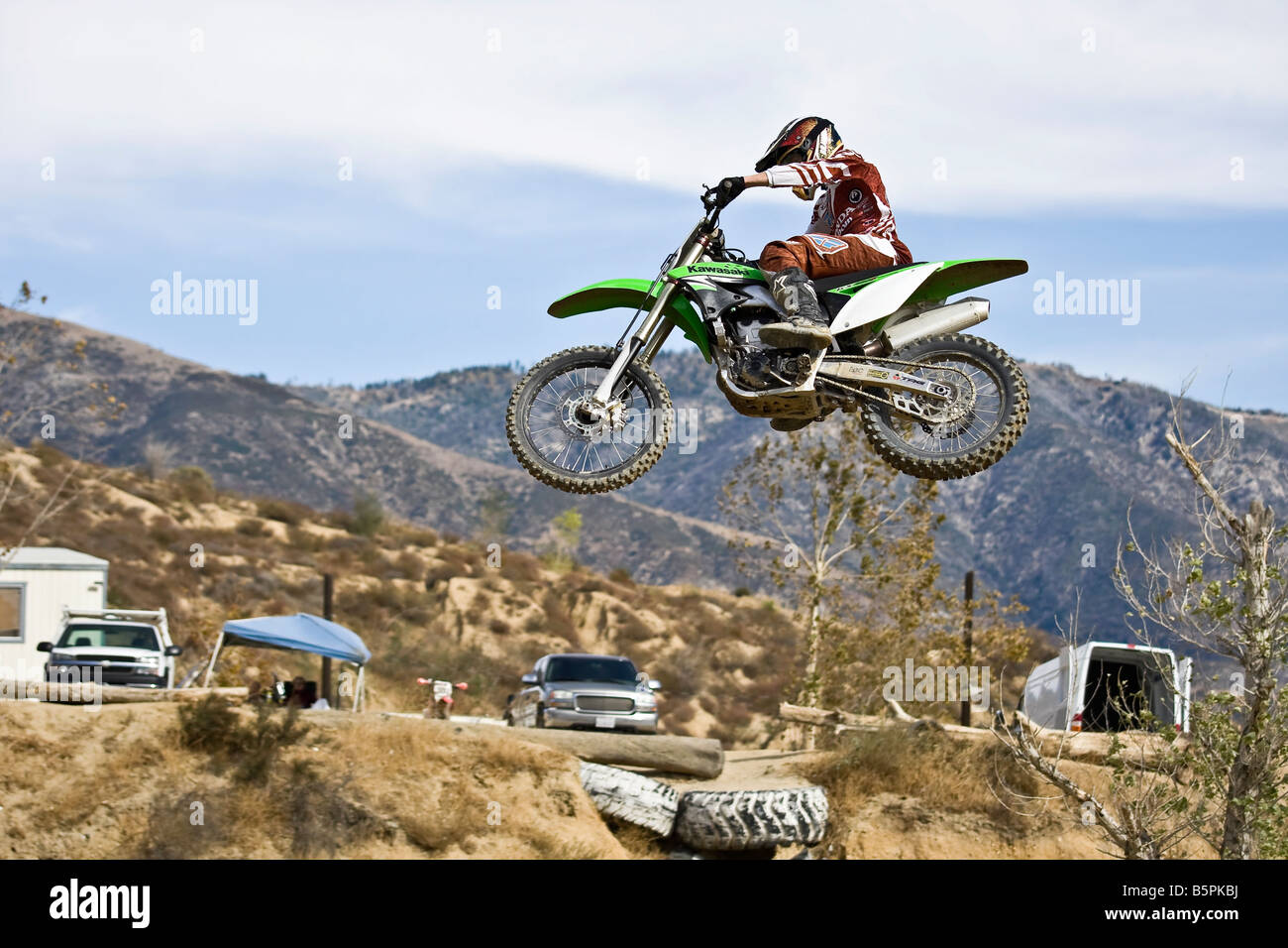 Motorcross rider jumping over a ramp at Glen Helen circuit Devore California. Stock Photo