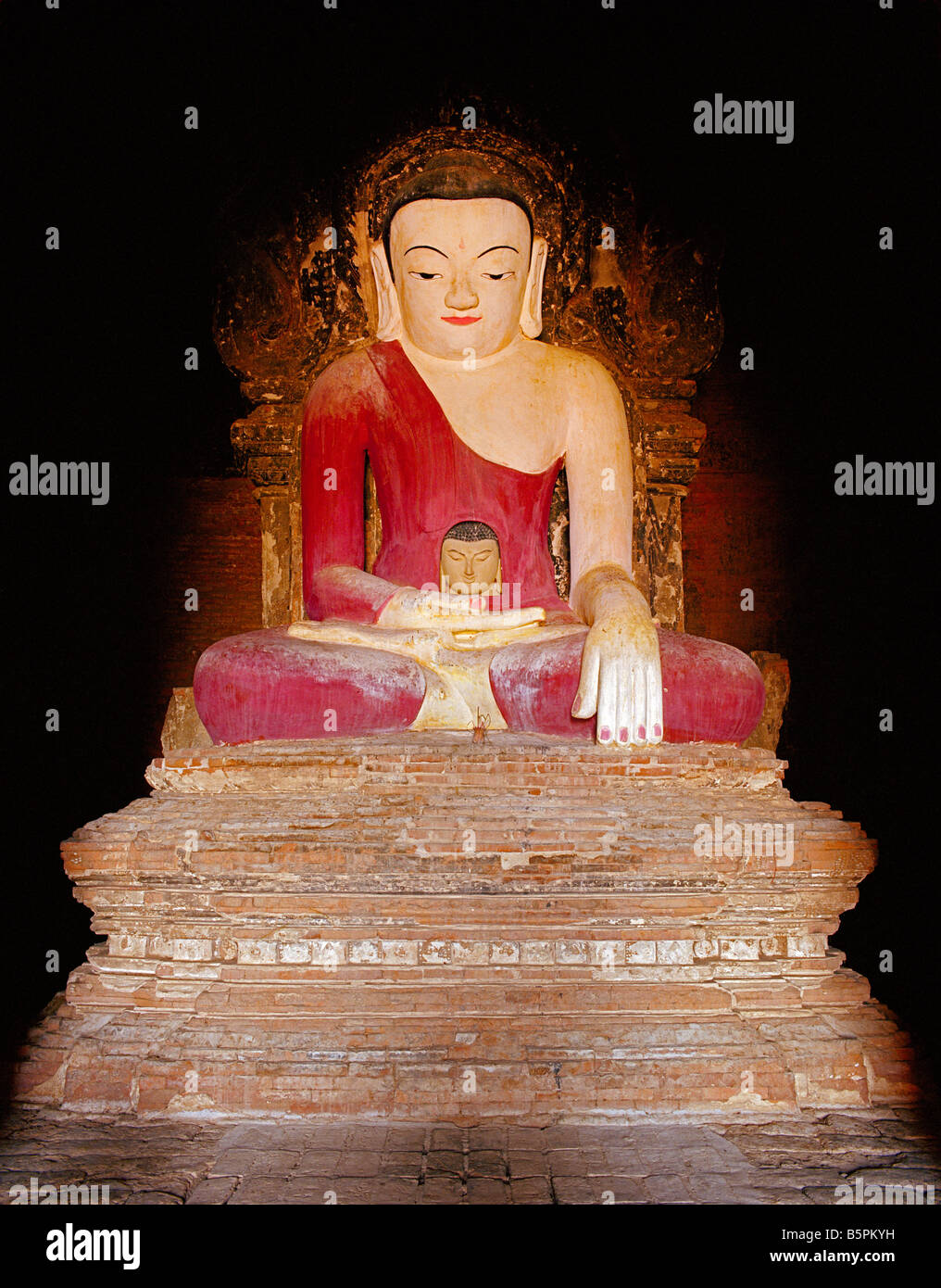buddha with a second buddha face in his trunk in Thagyarpone Paya Nyaung U Bagan (Pagan) Stock Photo