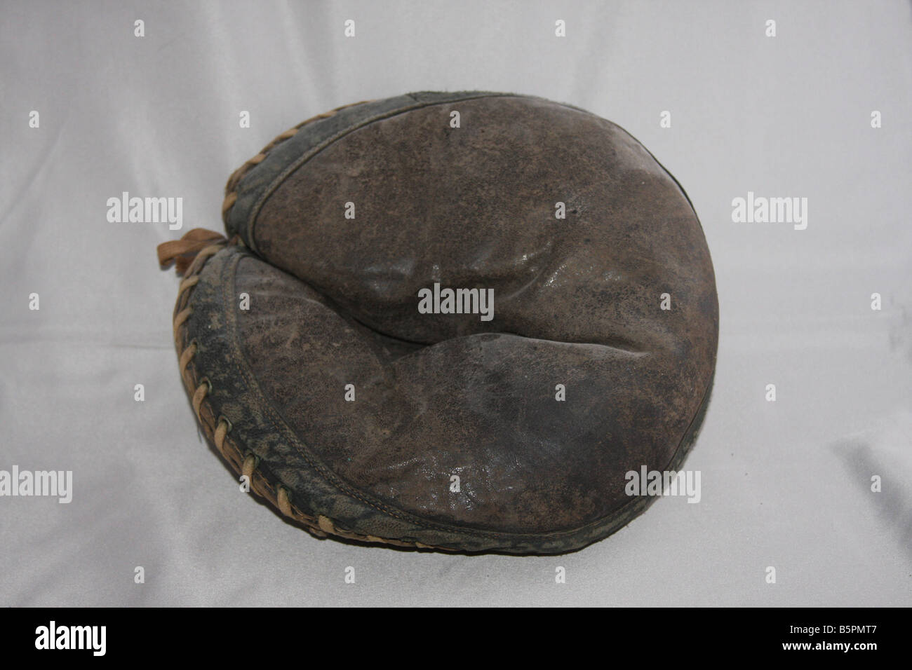 Old catcher's mitt that would be a treasure for any sports memorabilia collector. Stock Photo