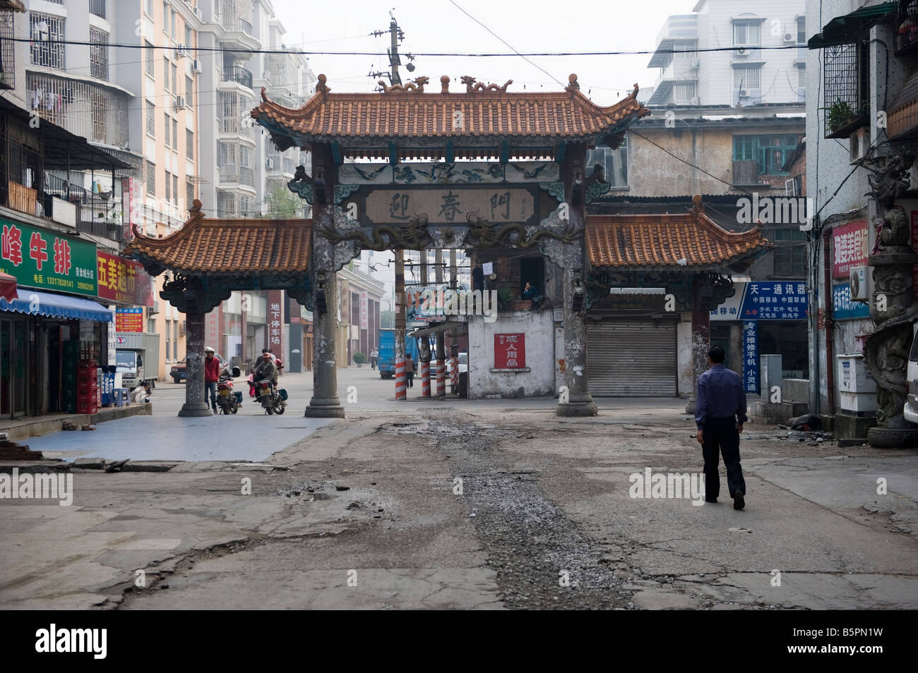 A Chinese man walks along a street in the famous city og Guilin, south China Stock Photo
