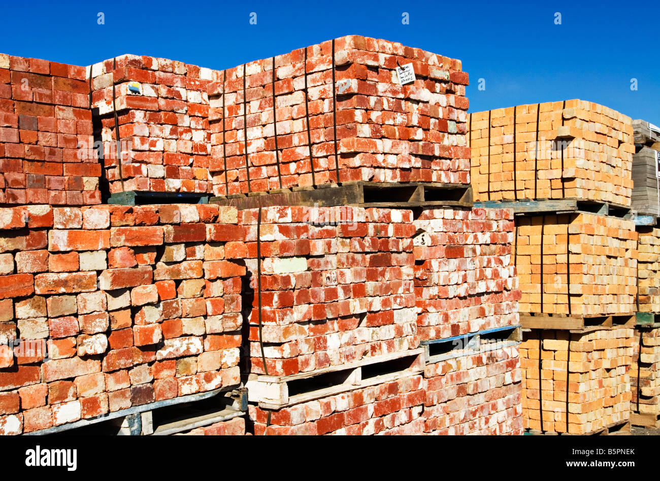 Building Materials / Stacked Pallets of used Building Bricks at a Brick