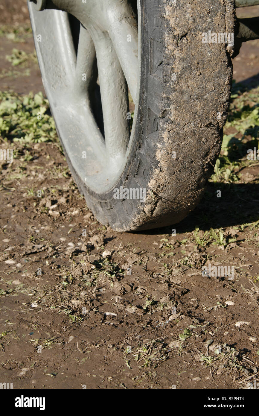 soil and dirt on old militray vehicle tyre in field Stock Photo