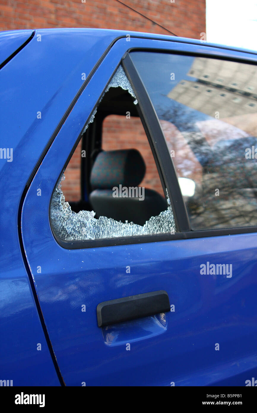 Car crime. A car with a broken rear window Stock Photo - Alamy