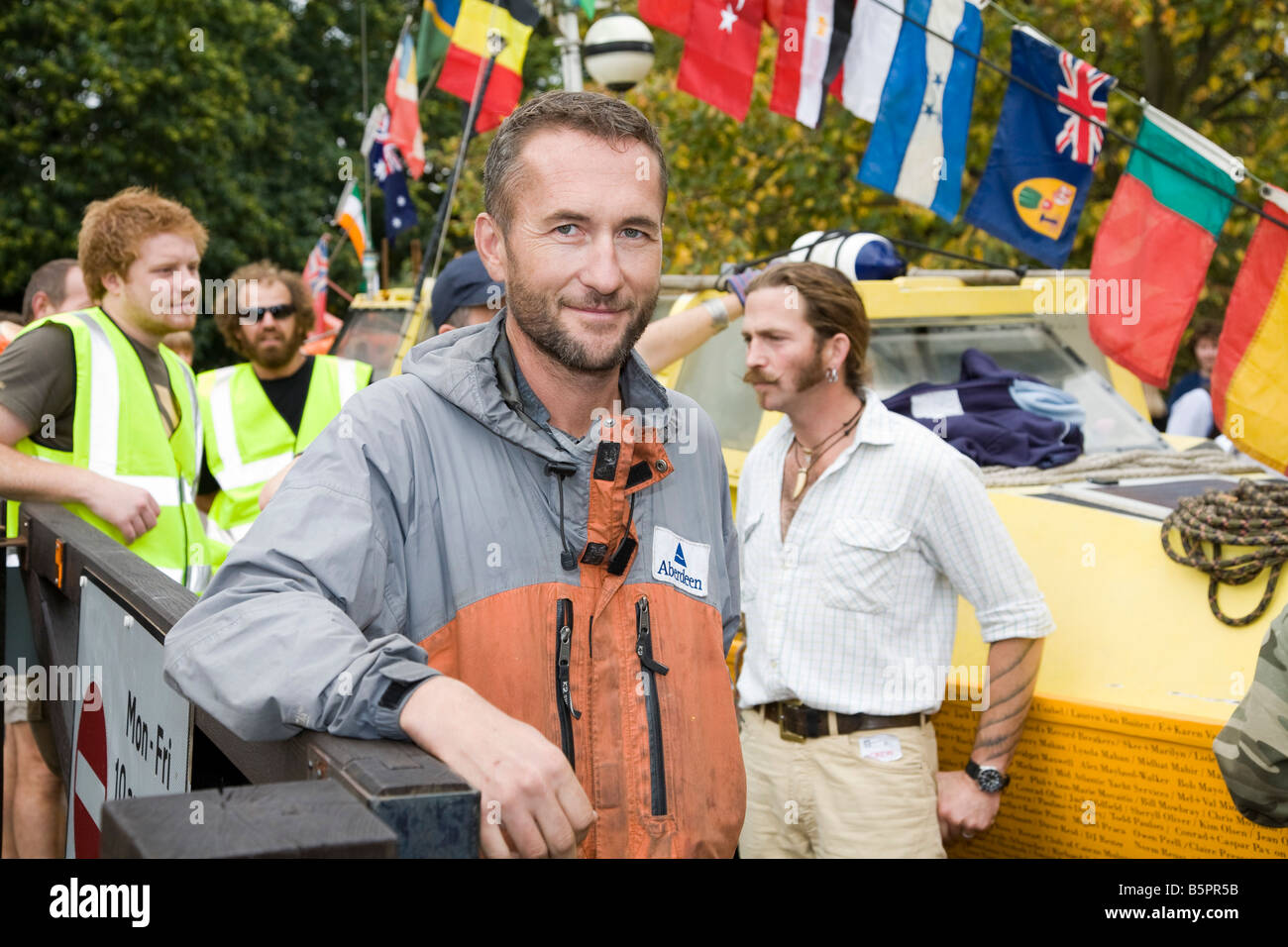 Jason Lewis stands in front of Moksha at the completion of Expedition 360. Stock Photo