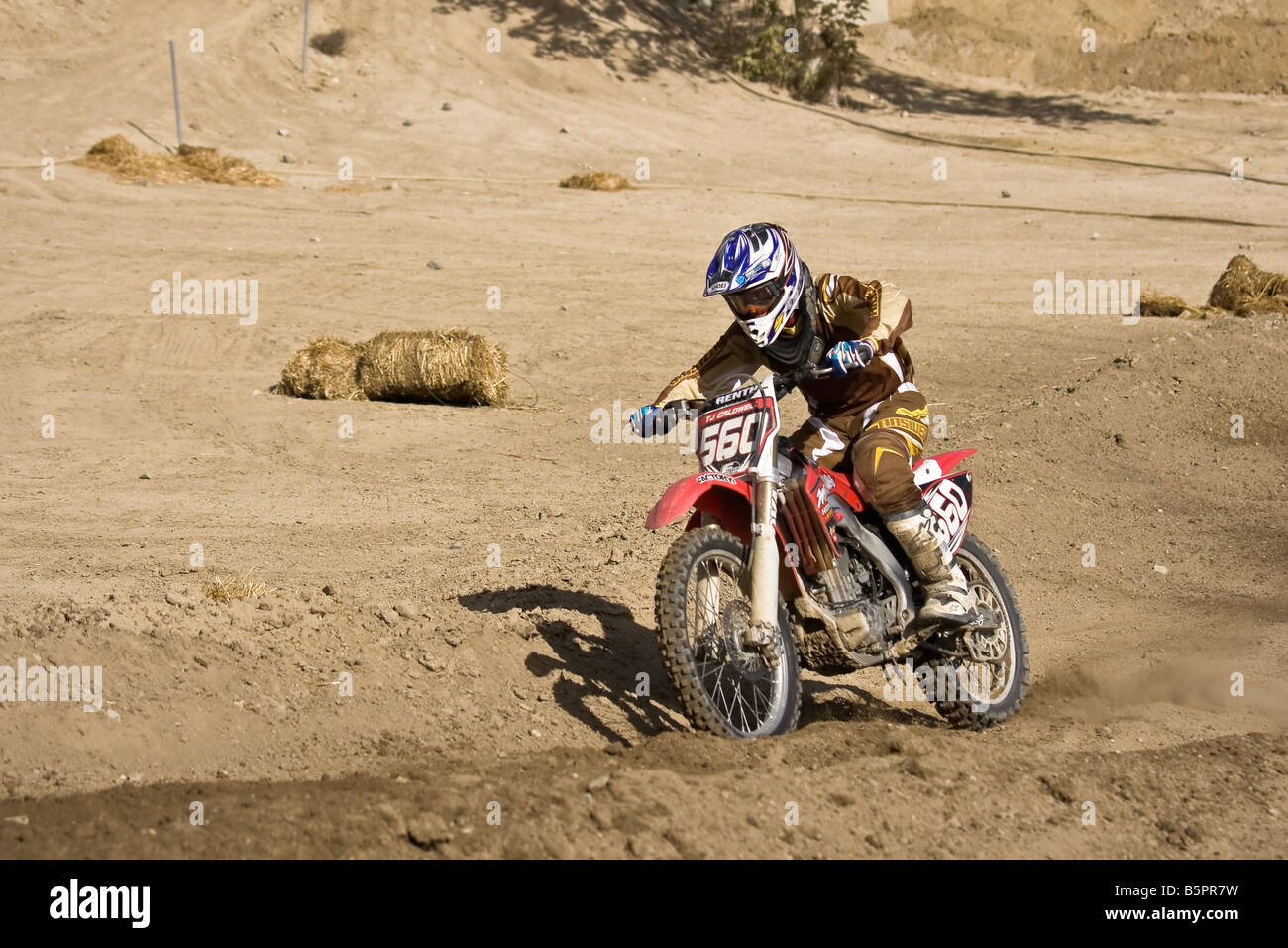Motorcross rider sweeping through a bend at Glen Helen circuit Devore California. Stock Photo