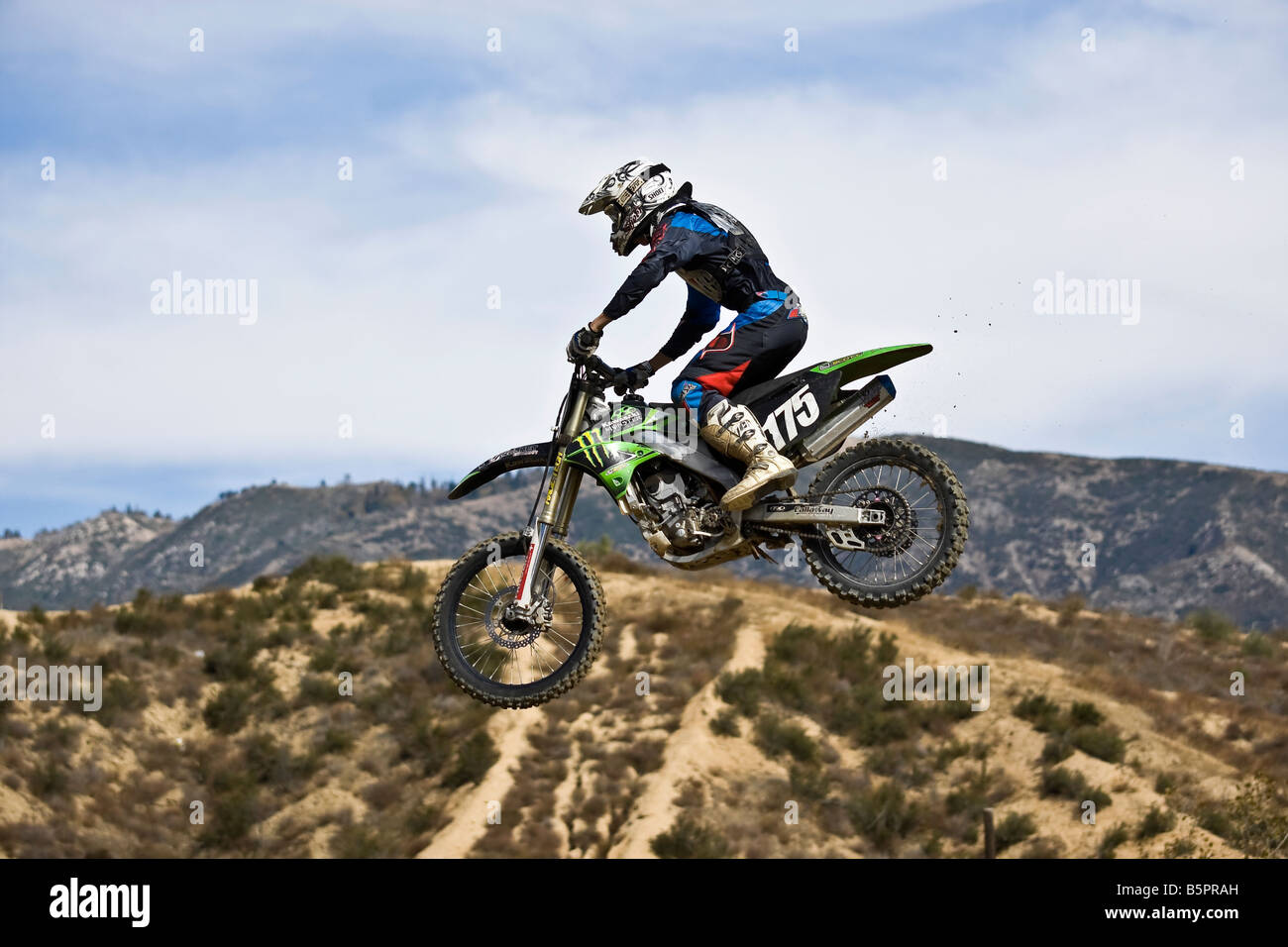 Motorcross rider jumping over a ramp at Glen Helen circuit Devore California. Stock Photo