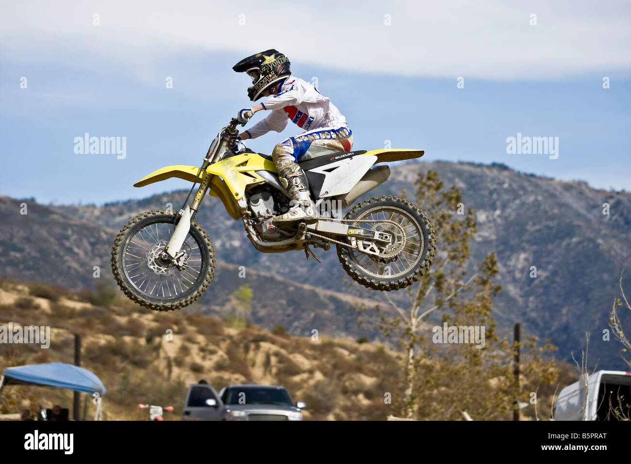 Motorcross rider jumping over a ramp at Glen Helen circuit Devore California. Stock Photo