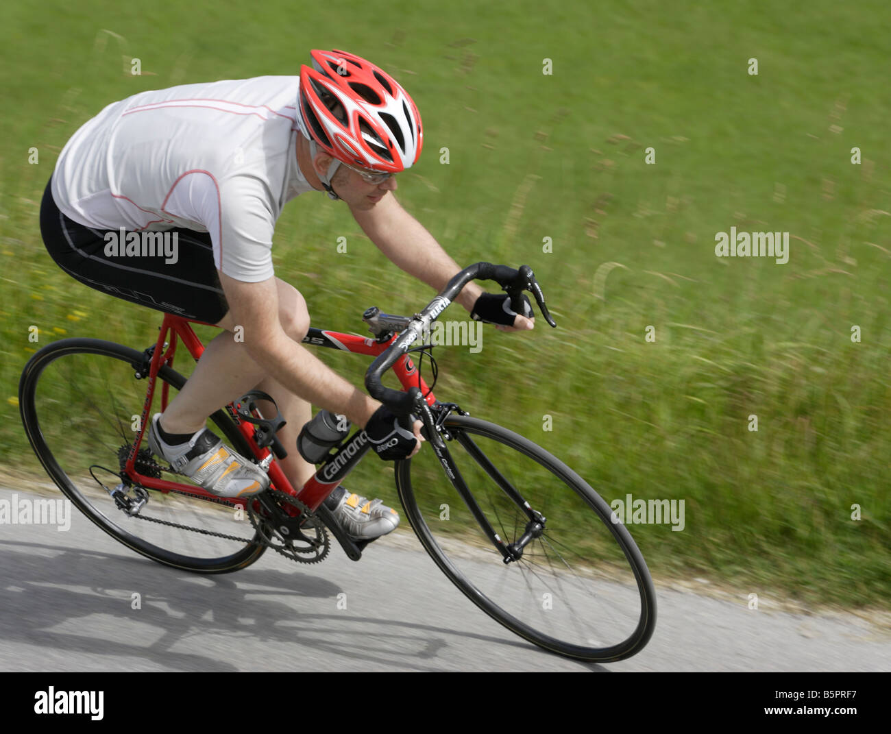 Racing cyclist wearing a helmet Stock Photo Alamy