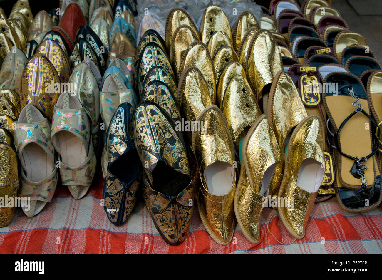 Souvenir shoes for sale in Khan al Khalili Bazaar, Egypt Stock Photo