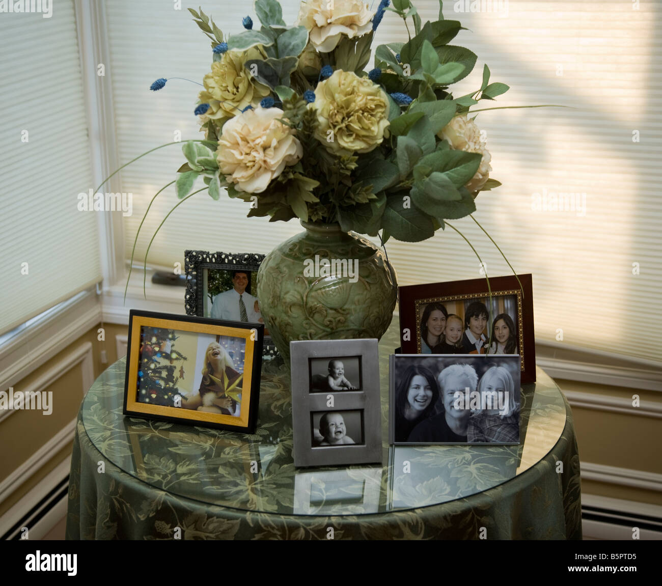 Table with family photographs Stock Photo - Alamy