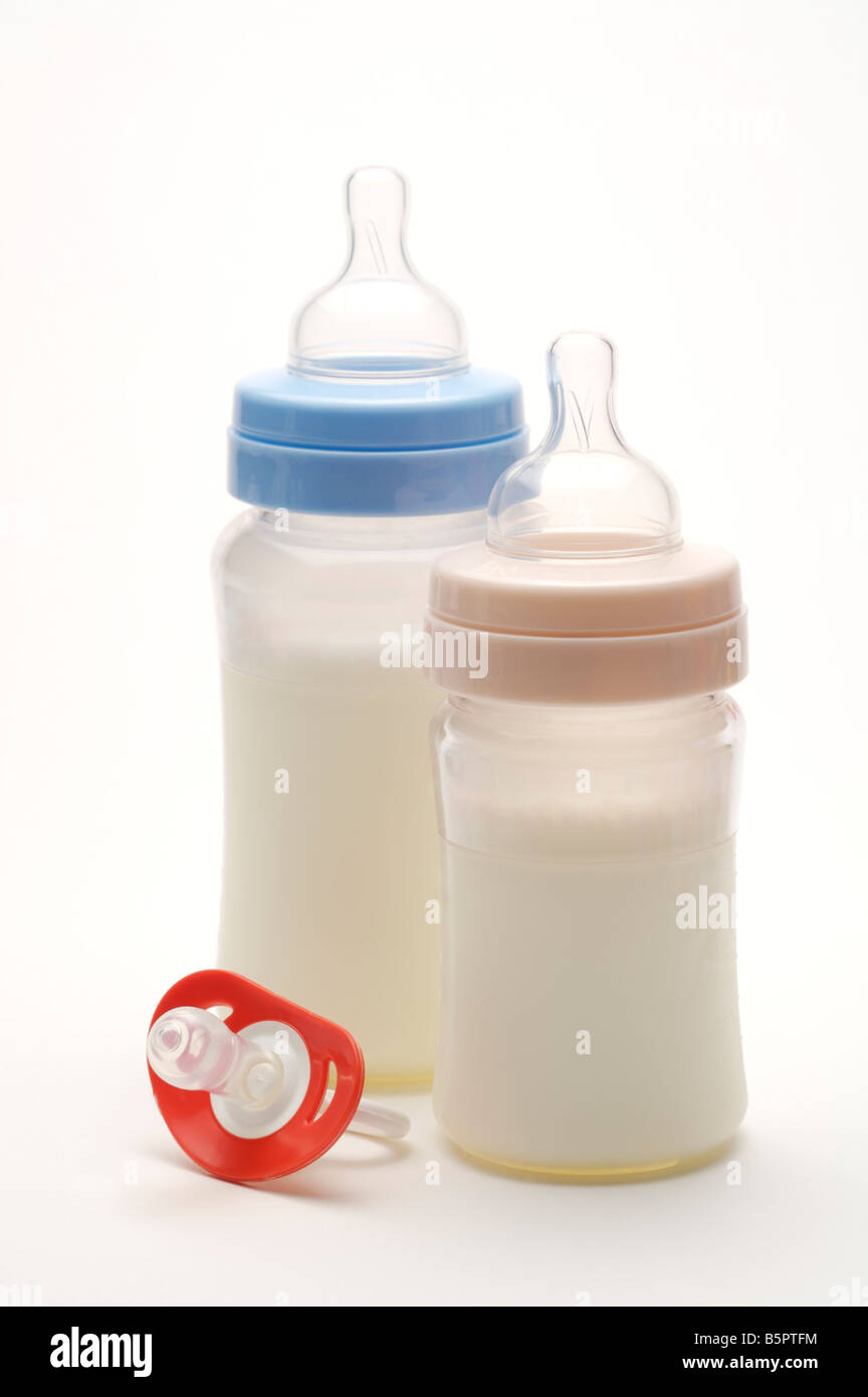 https://c8.alamy.com/comp/B5PTFM/two-baby-bottles-filled-with-milk-and-a-red-pacifier-B5PTFM.jpg