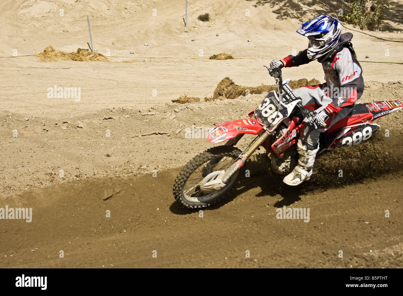 Motorcross rider sweeping through a bend at Glen Helen circuit Devore California. Stock Photo