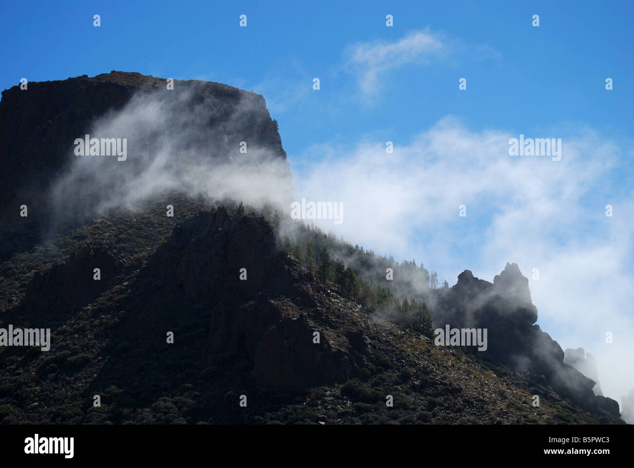 Mist rolling over lava rocks, Los Roques de Garcia, Parque Nacional Del Teide, Tenerife, Canary Islands, Spain Stock Photo