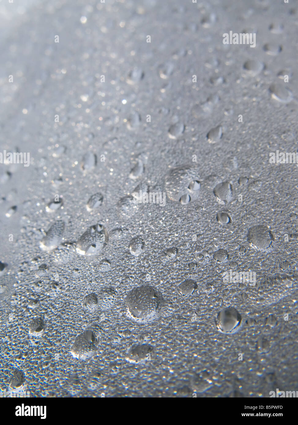 Blue water droplets in a glass surface background Stock Photo - Alamy