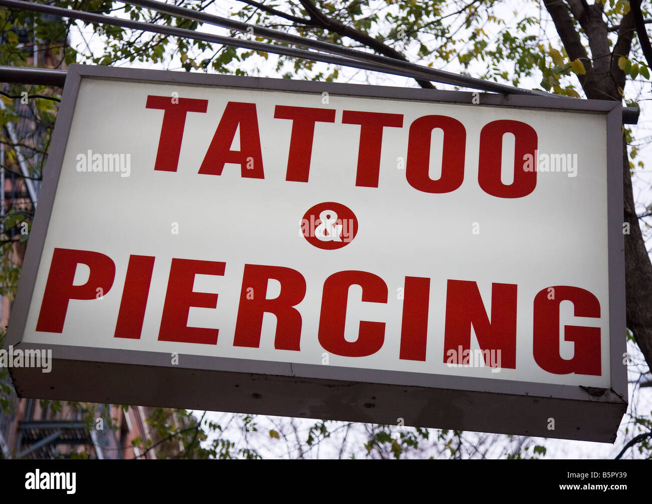 Sign above a tatoo parlor Stock Photo