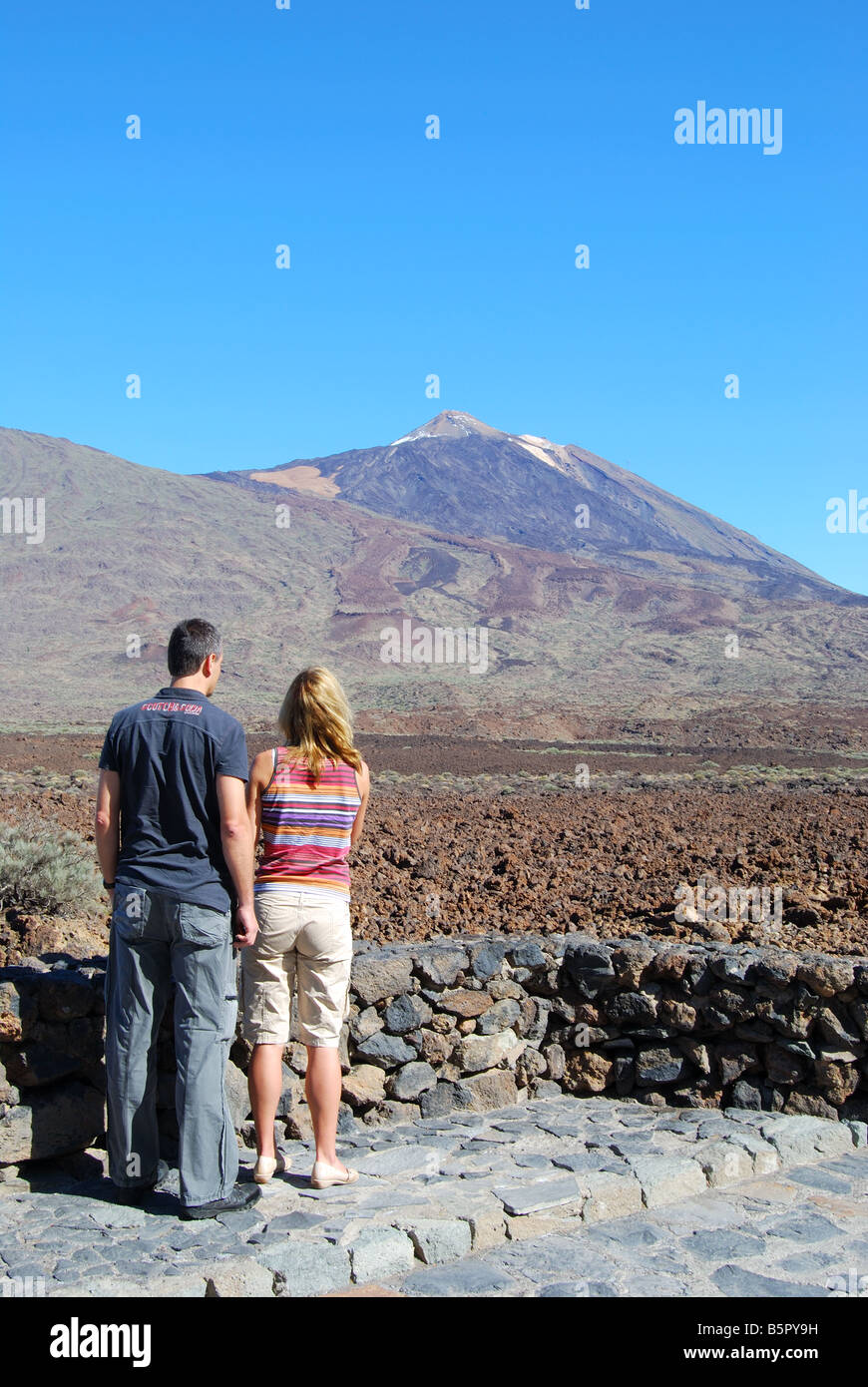 View of Mt.Teide across lava fields, from lookout point, Parque Nacional Del Teide, Tenerife, Canary Islands, Spain Stock Photo