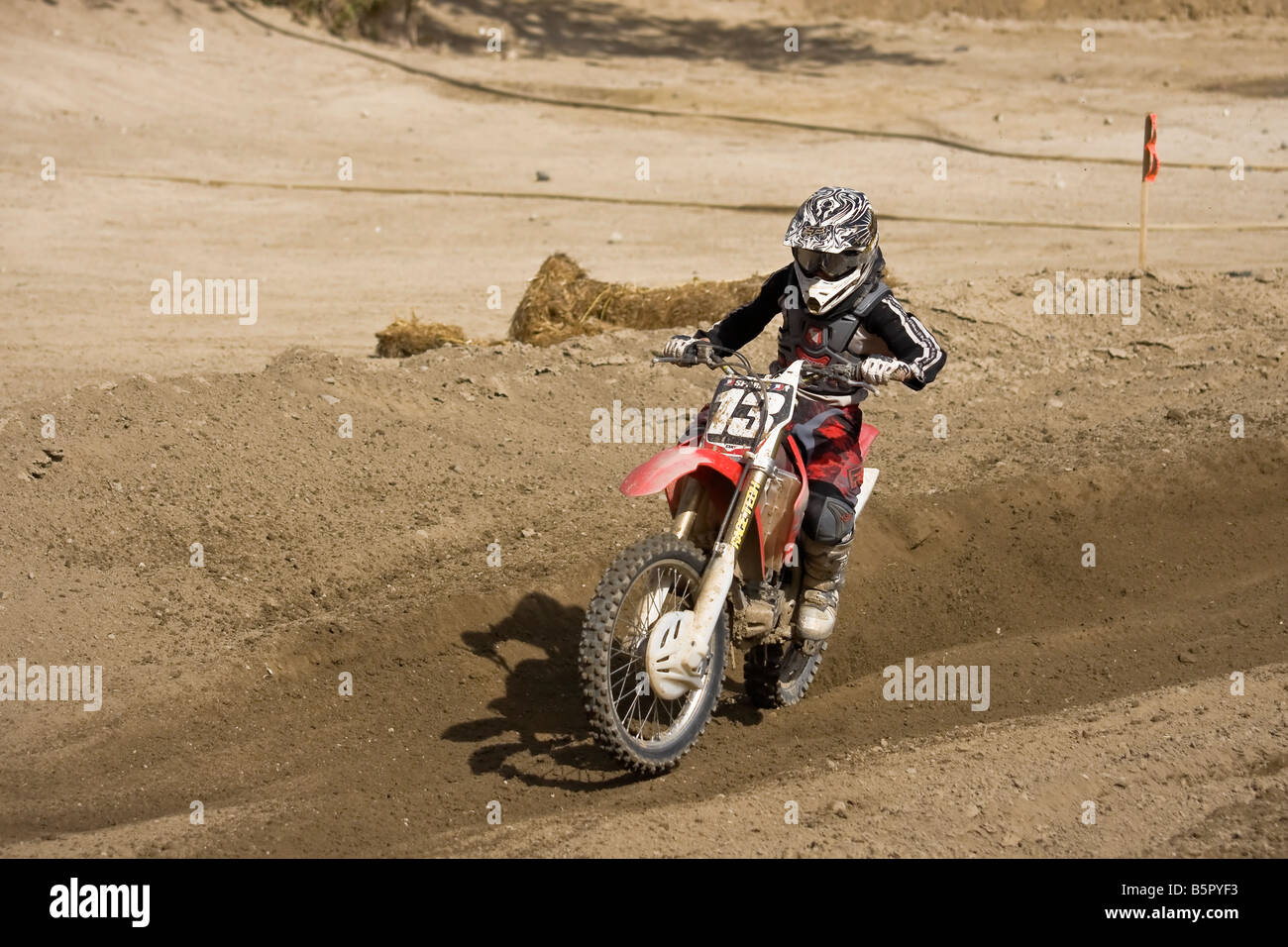 Motorcross rider sweeping through a bend at Glen Helen circuit Devore California. Stock Photo