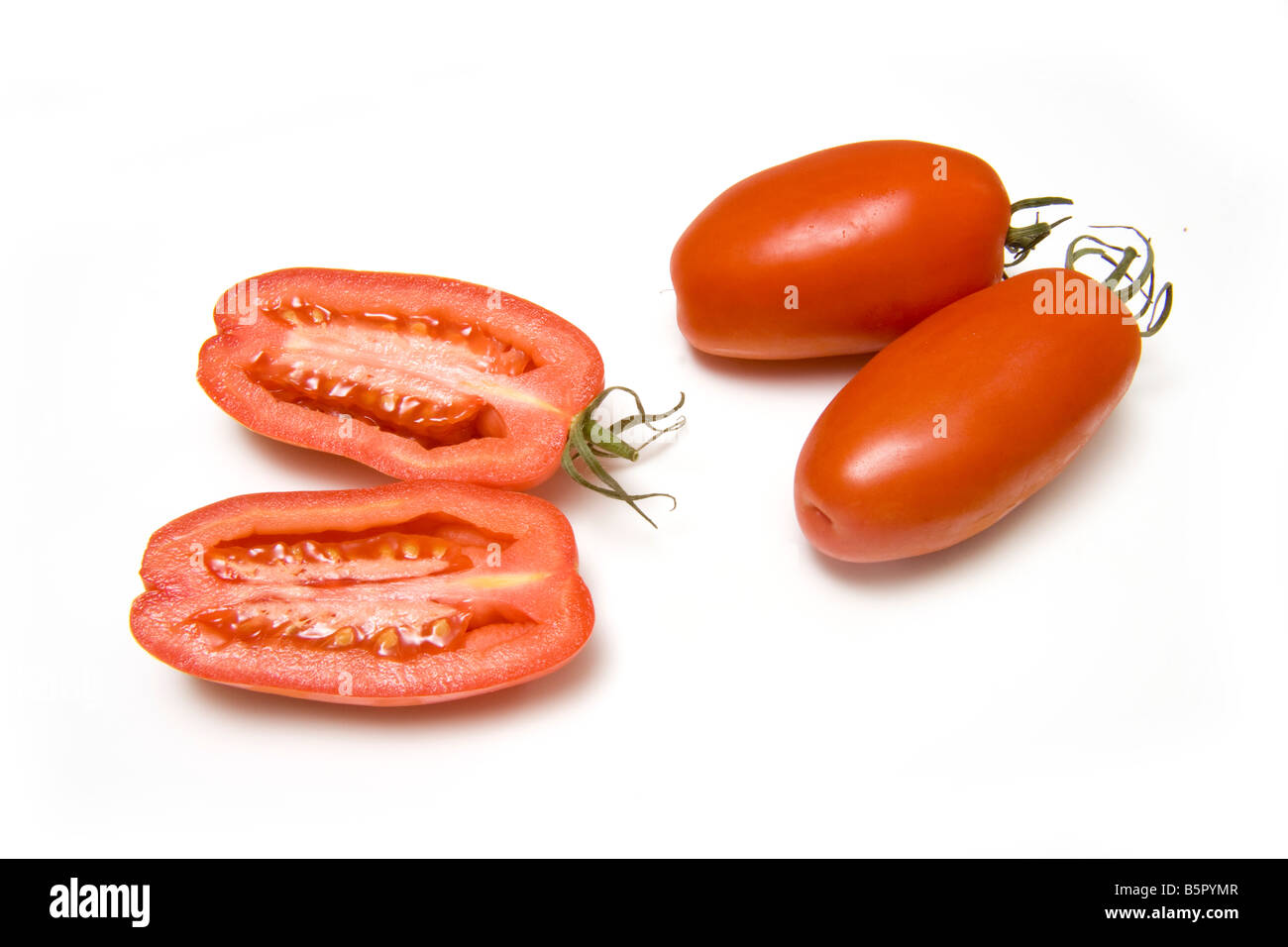 Plum tomatoes isolated on a white studio background Stock Photo - Alamy