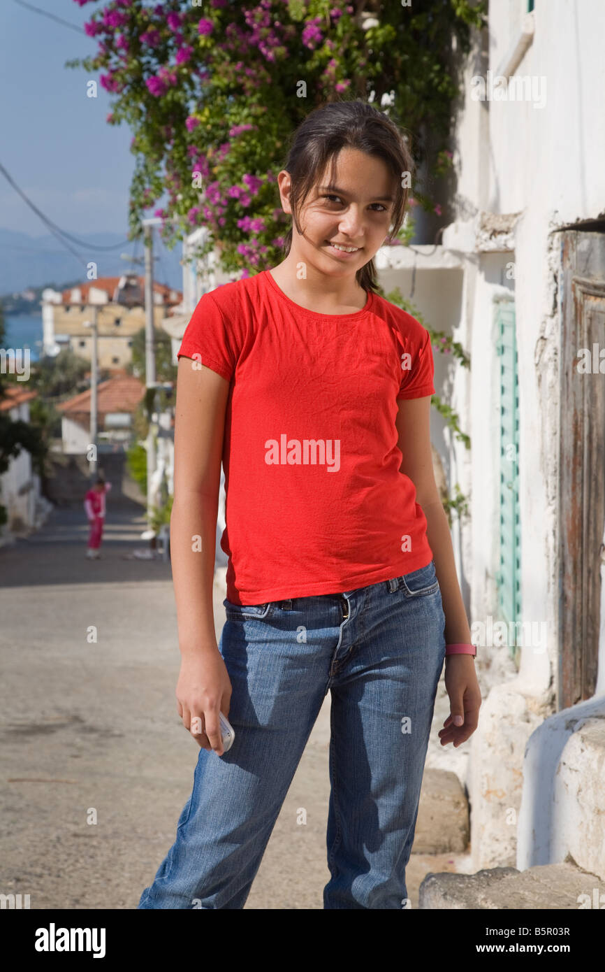 A Turkish young girl smiling in a street in Fethiye Turkey Stock Photo