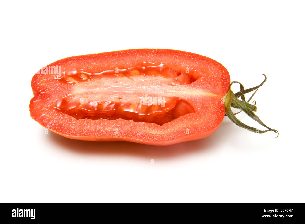 Plum tomatoes isolated on a white studio background Stock Photo - Alamy
