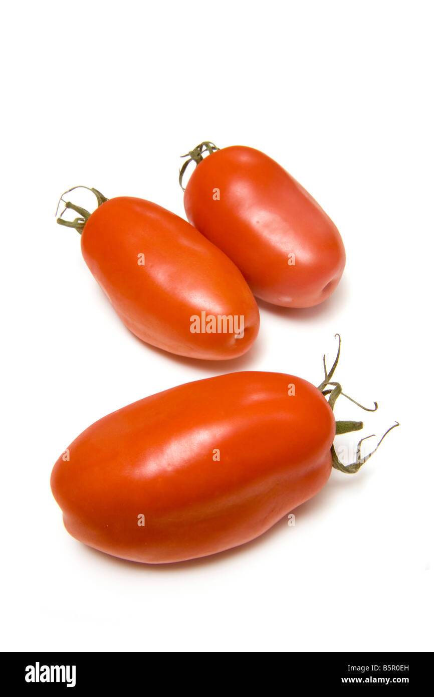 Plum tomatoes isolated on a white studio background Stock Photo - Alamy