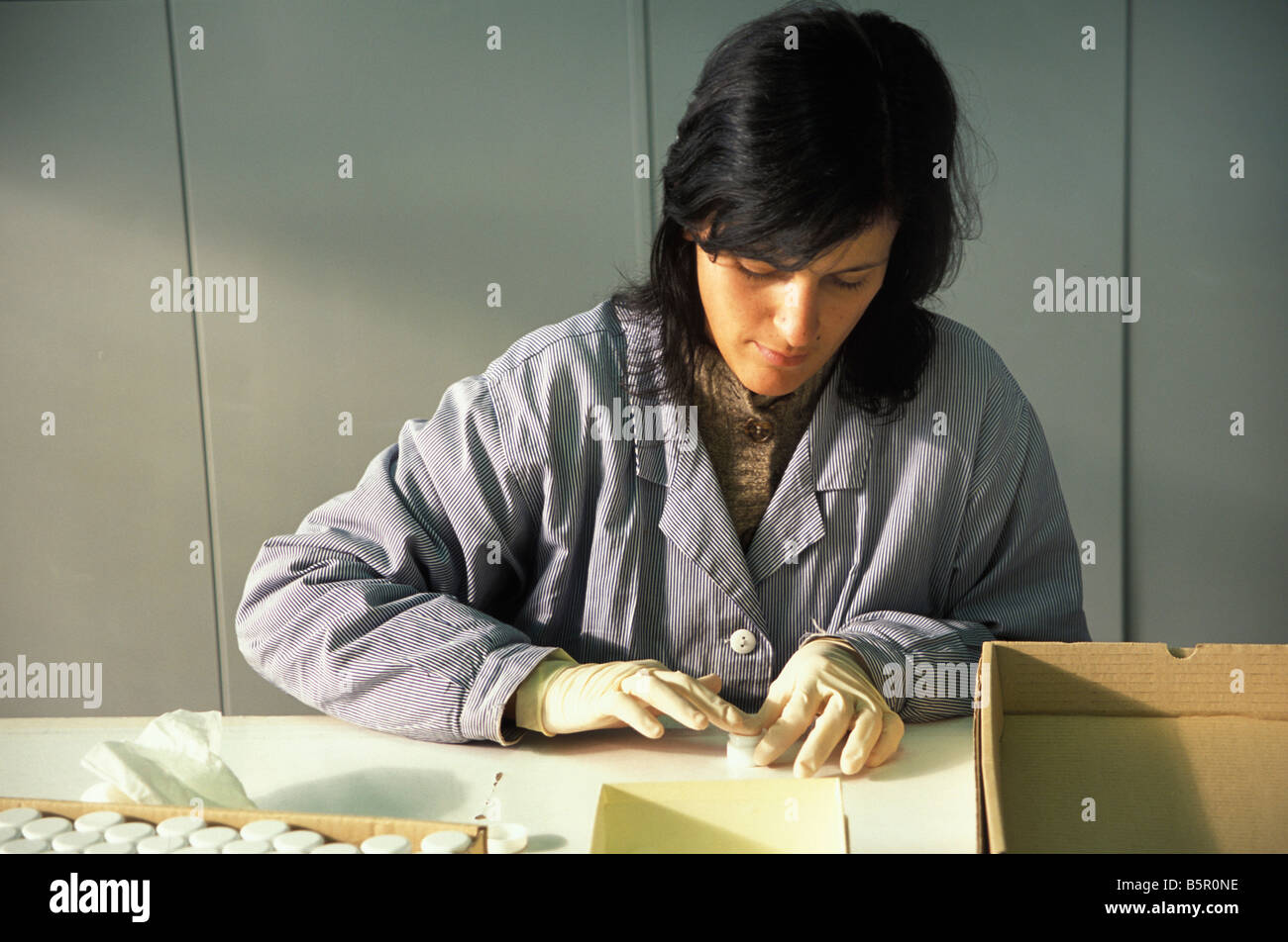 A worker in the small factory of the Santa Maria Novella pharmacy in