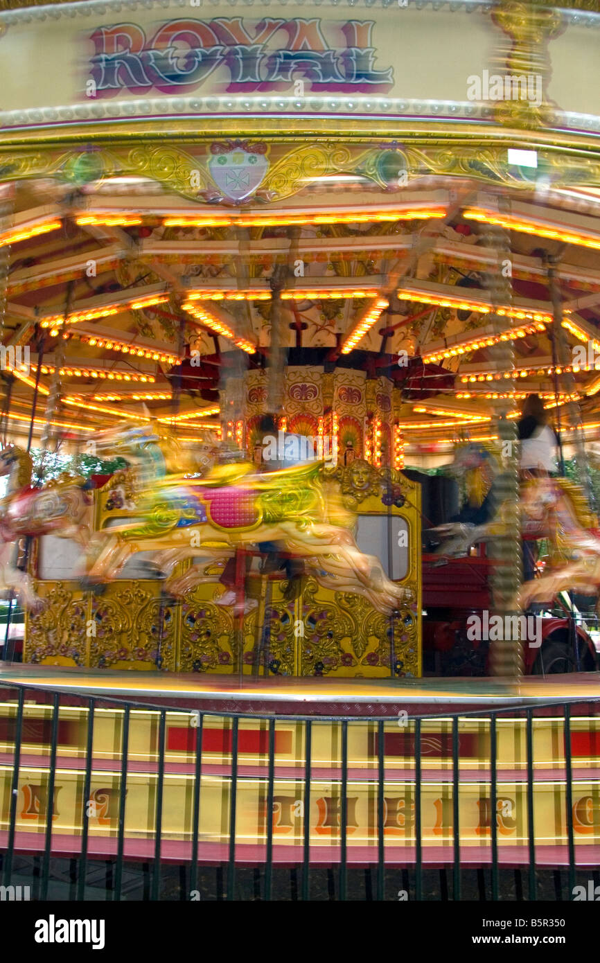 Merry go round in motion in the market town of Stratford upon Avon