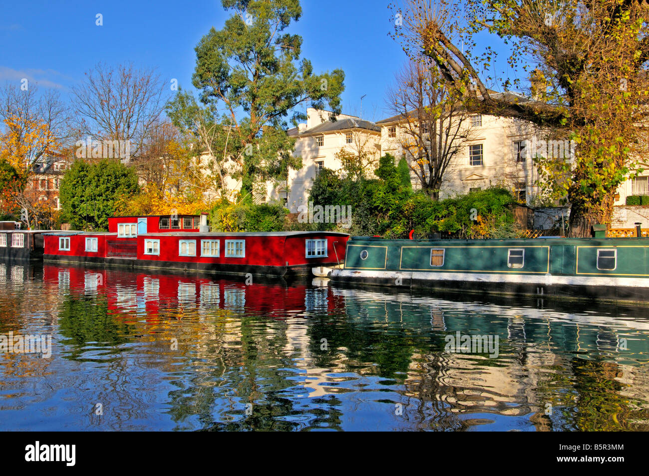 Houseboats and Barges on the Paddington Arm of the Grand Union canal close to Little Venice near Maida Vale London United Kingdom Stock Photo