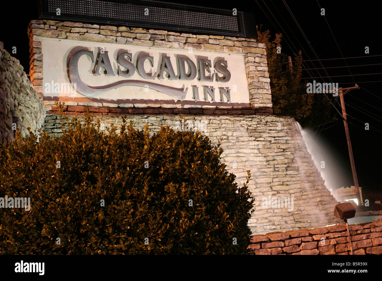 Cascades Inn motel sign at night, Branson Missouri Stock Photo