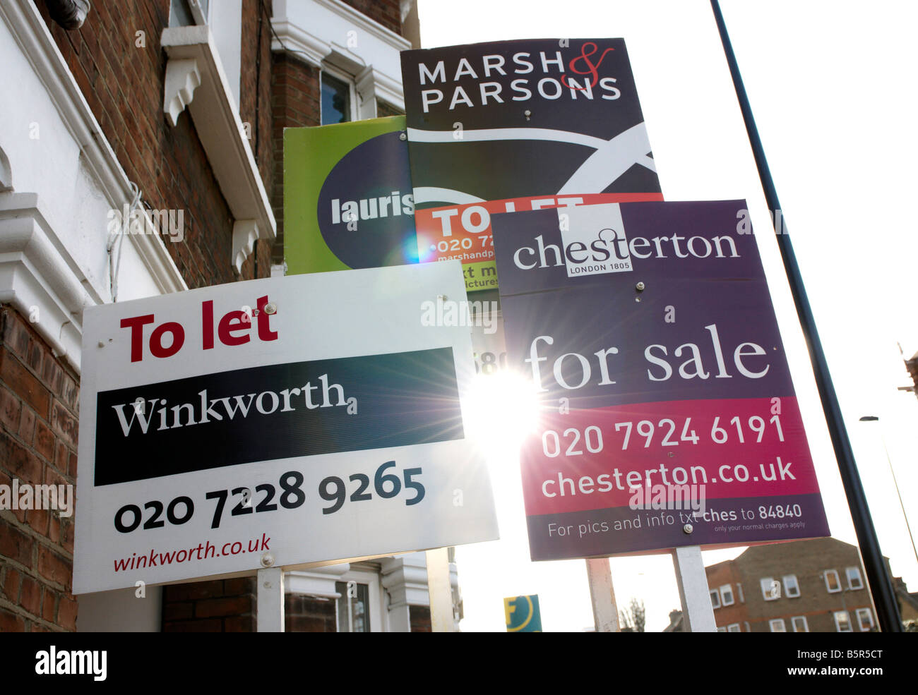A row of to let and for sale signs outside a maisonette in London, England, UK Stock Photo