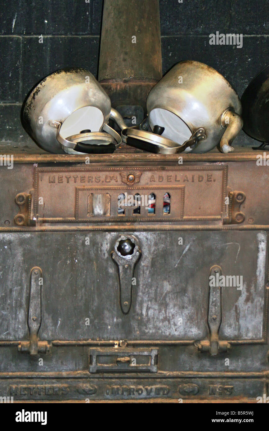 Kettles and Old Wood Stove Stock Photo