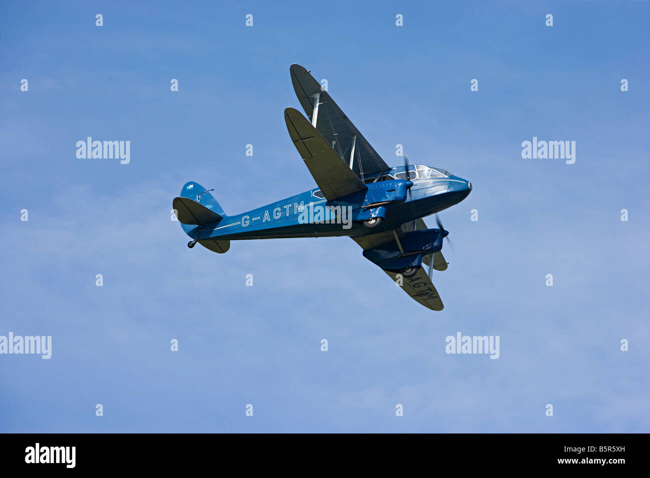 De Havilland DH-89A Dominie aircraft just after take off at Goodwood  Revival Stock Photo