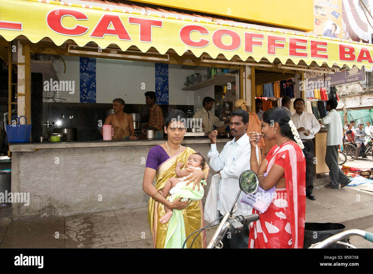 Indians drinking coffee at a corner coffee bar in Pondicherry India. Stock Photo