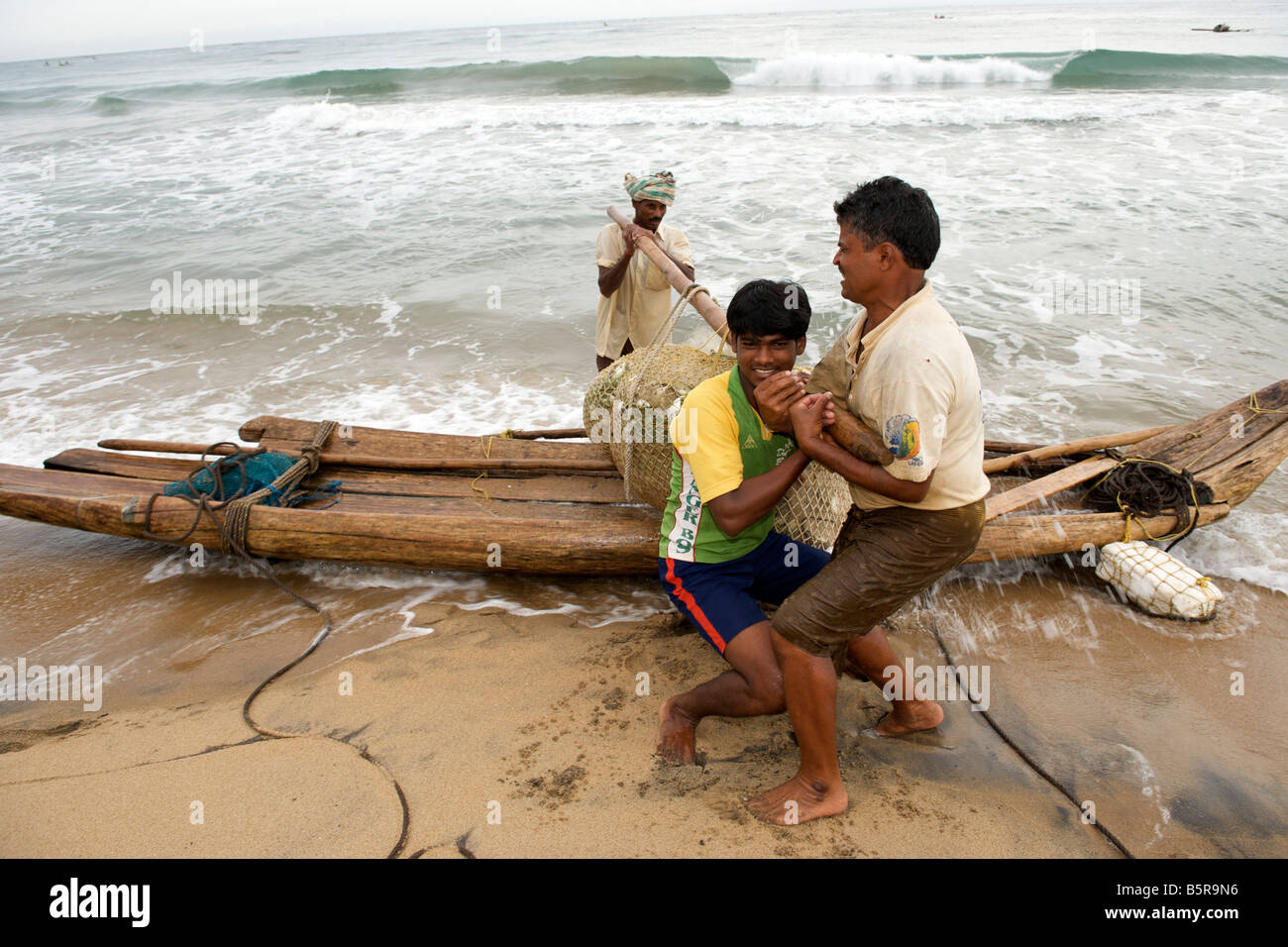 Fishermen on Kalapet beach near Pondicherry India. Stock Photo