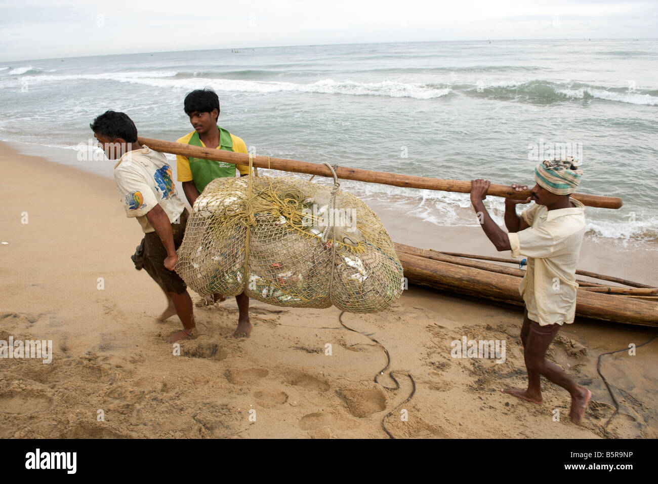 Fishermen on Kalapet beach near Pondicherry India. Stock Photo