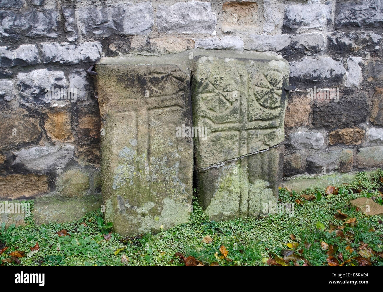 Early hand carved medieval grave markers Headstones at Eyam in Derbyshire England UK Village churchyard Stock Photo