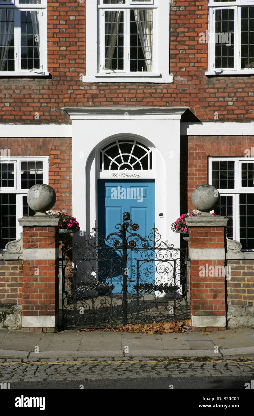 Classic front door with pillars and wrought iron gates Stock Photo Alamy