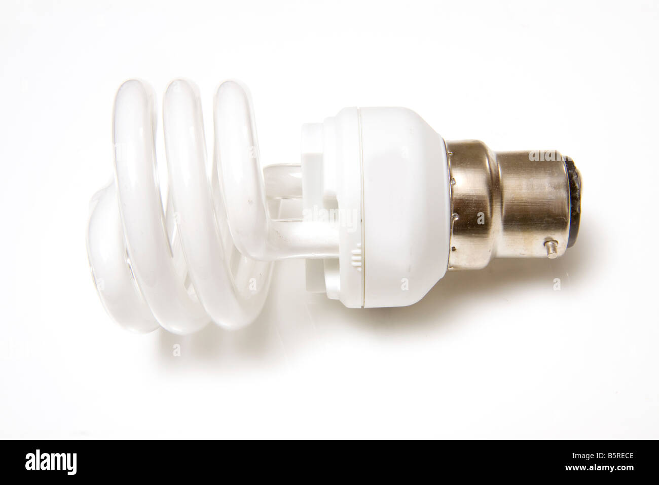 Energy saving fluorescent light bulb isolated on a white studio ...