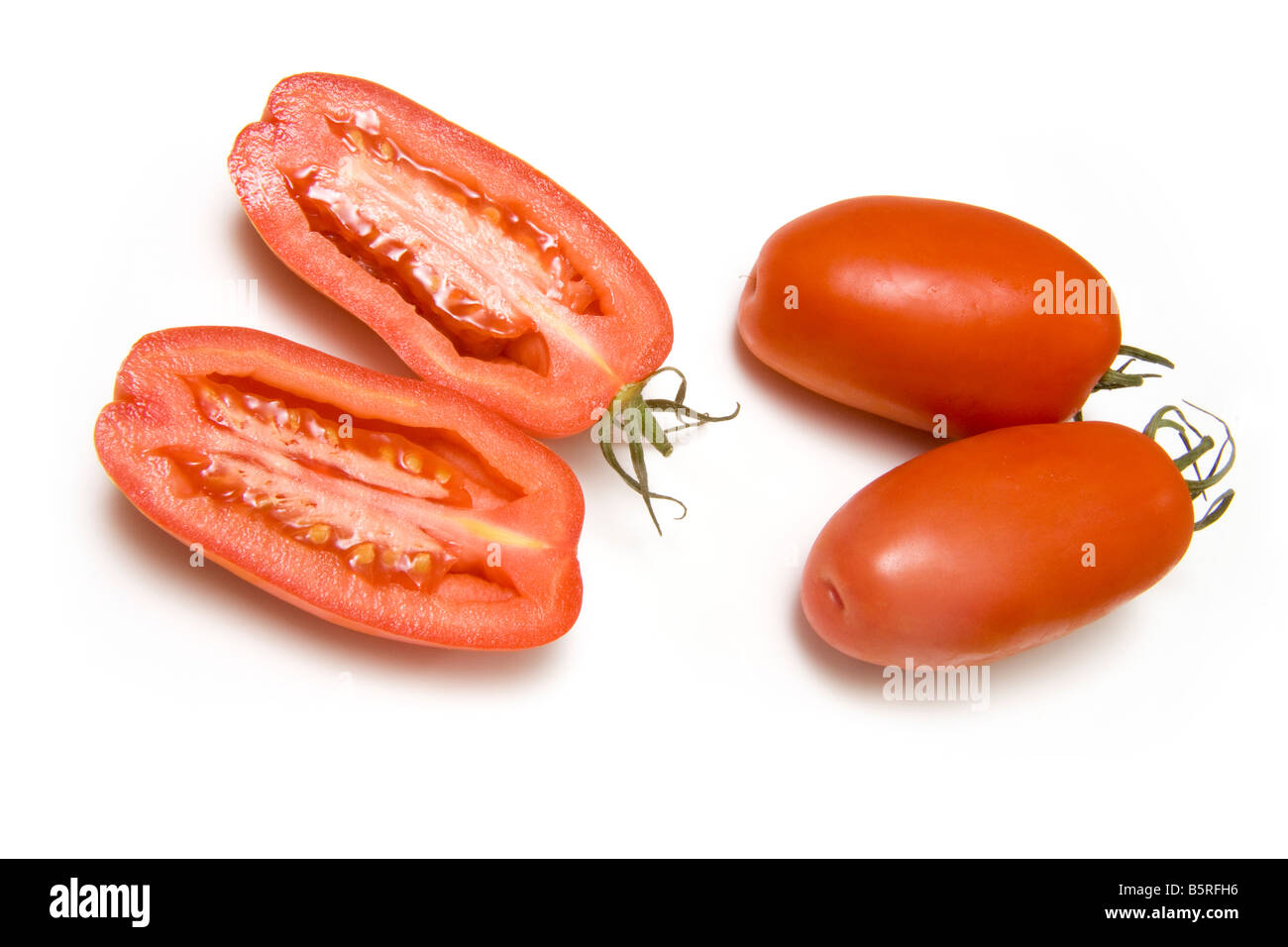 Plum tomatoes isolated on a white studio background Stock Photo - Alamy