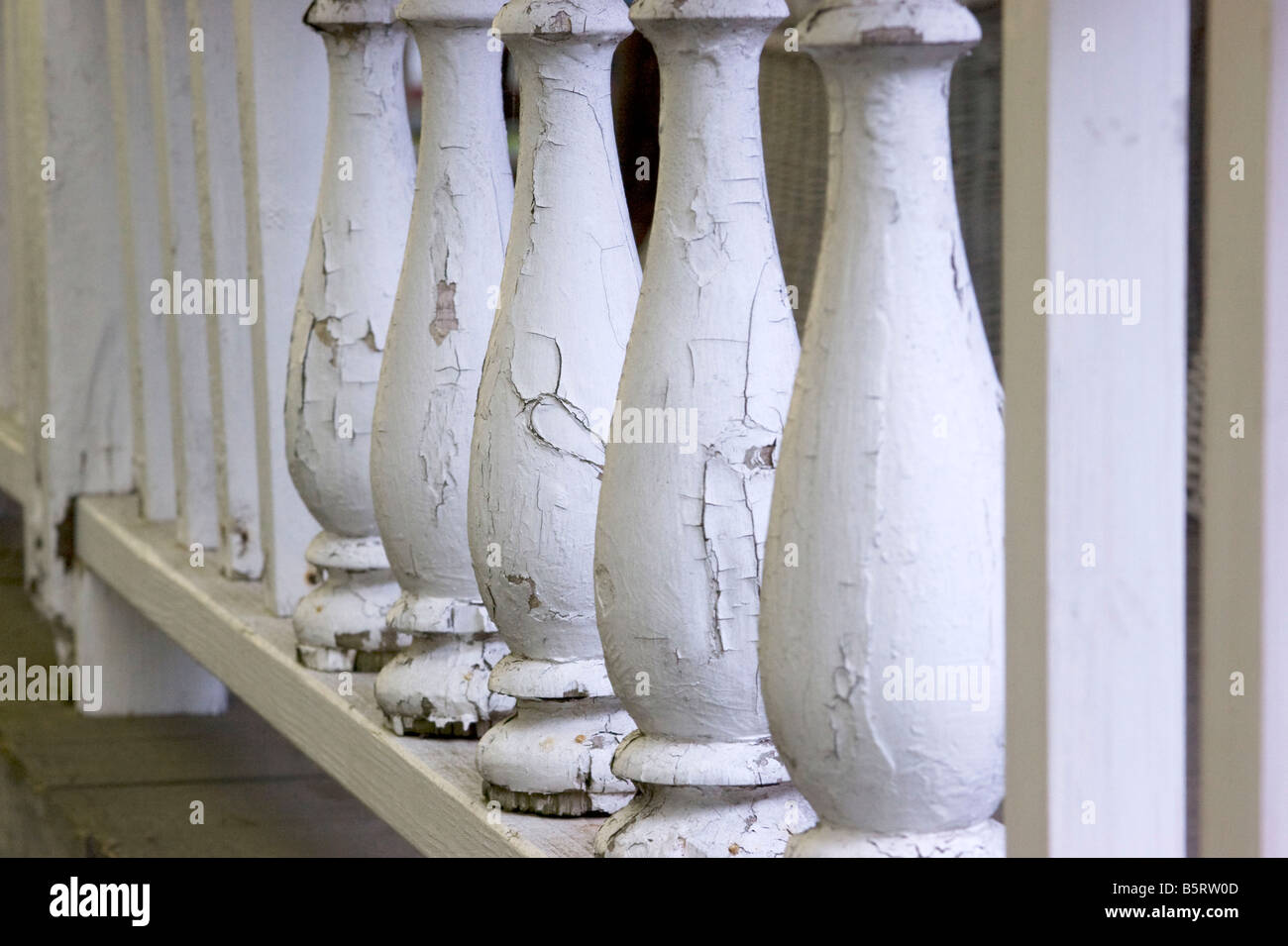 A balustrade with peeling paint on a porch in Martha's Vineyard Stock