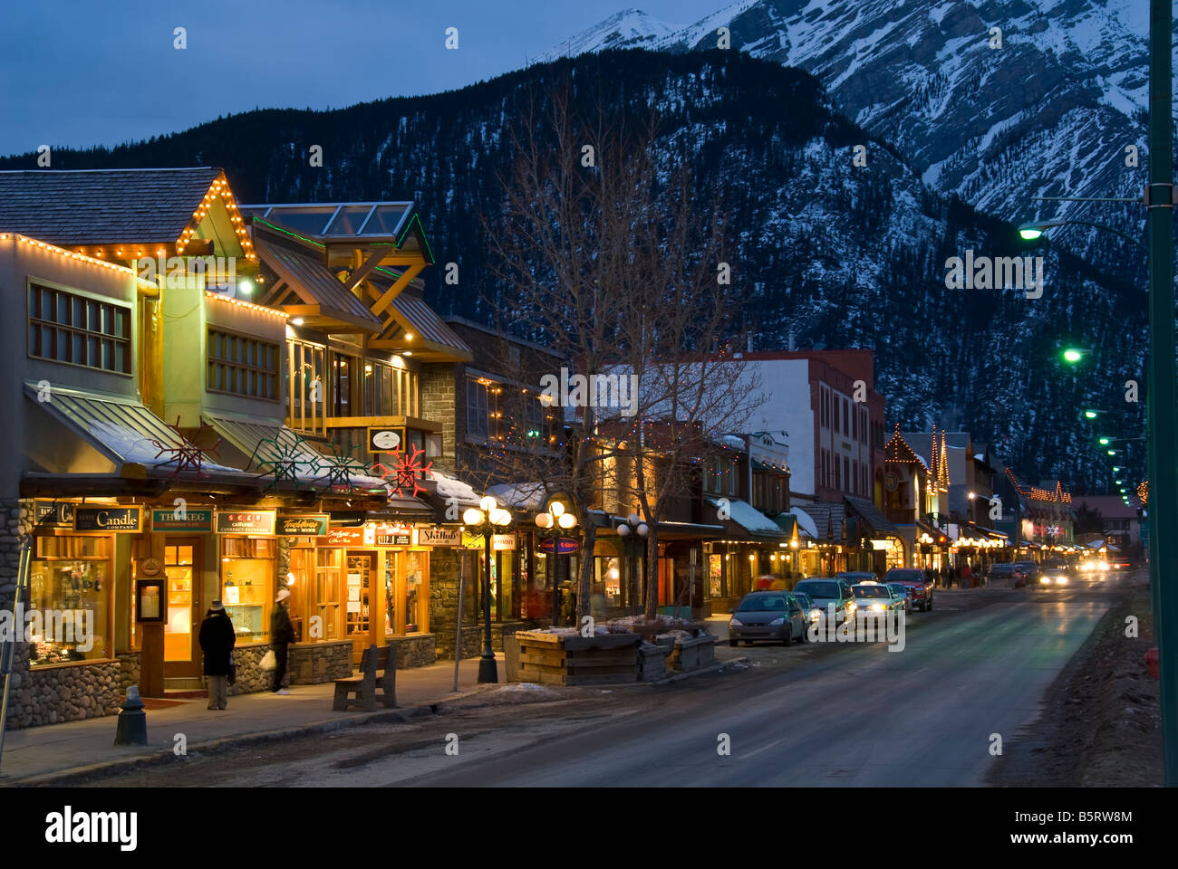 Shops along Banff Avenue at twilight, Banff townsite, Banff National Park, Alberta, Canada. Stock Photo