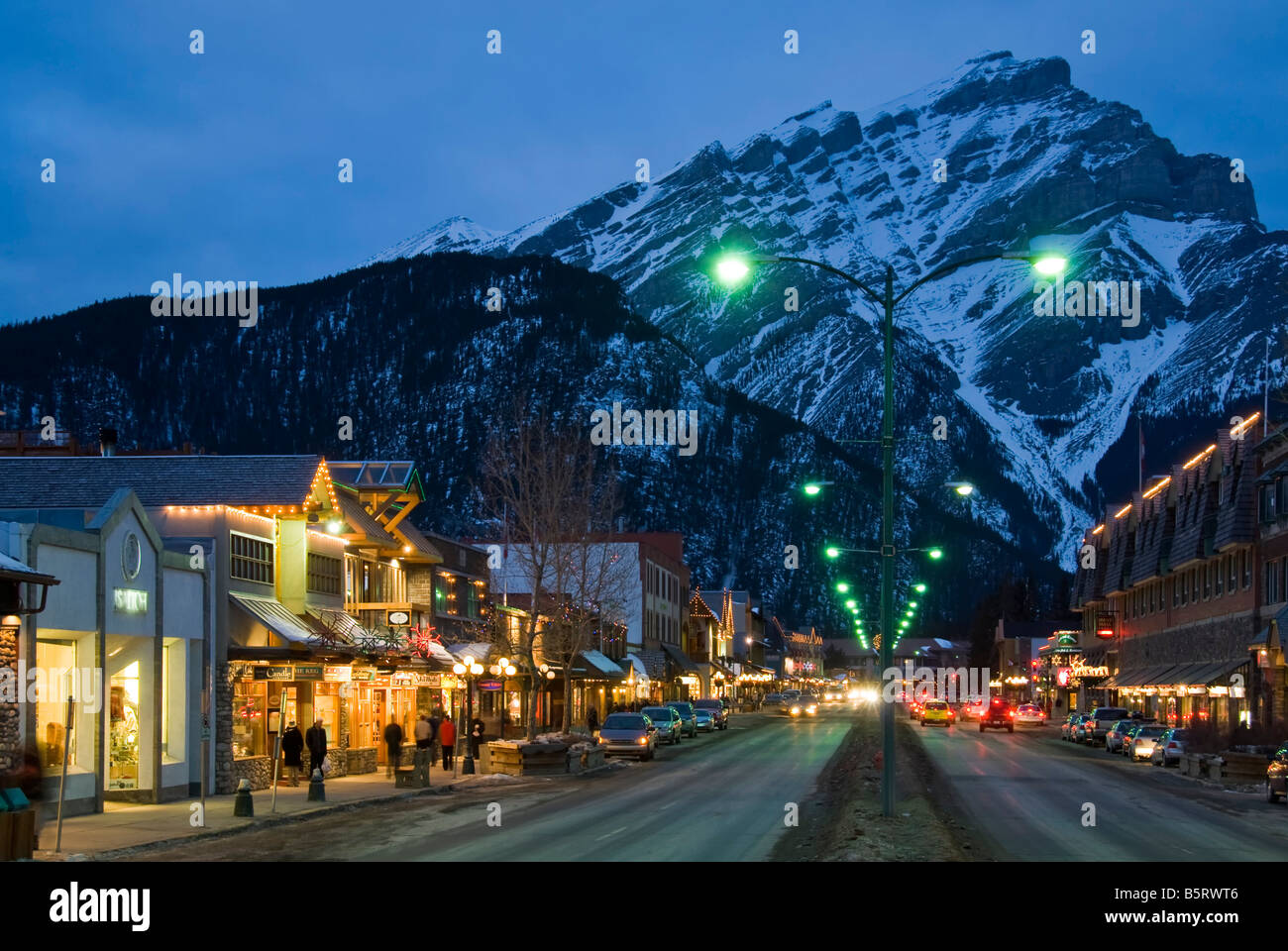 Shops along Banff Avenue at twilight, Banff townsite, Banff National Park, Alberta, Canada. Stock Photo