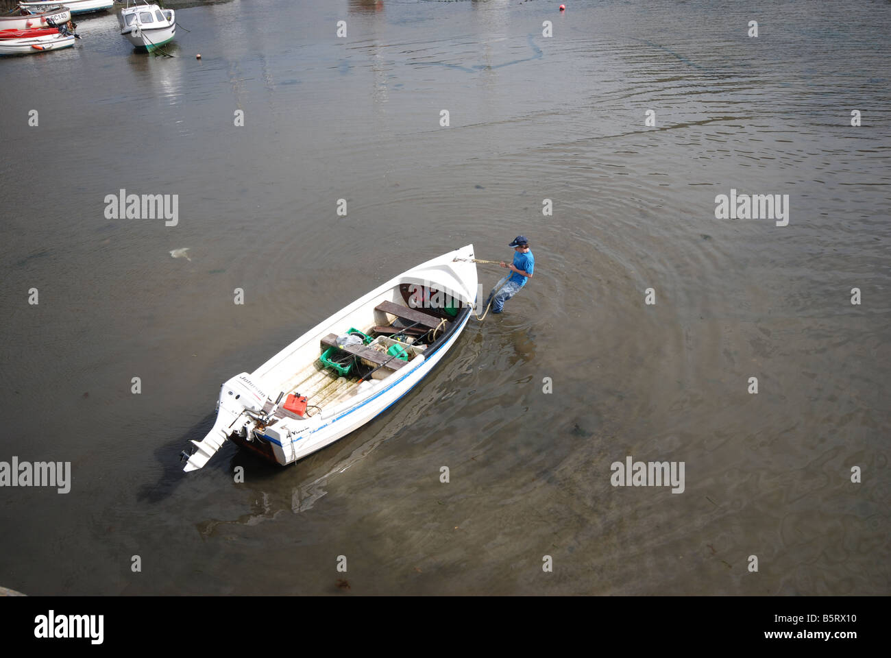 Man pulling a boat hi-res stock photography and images - Alamy