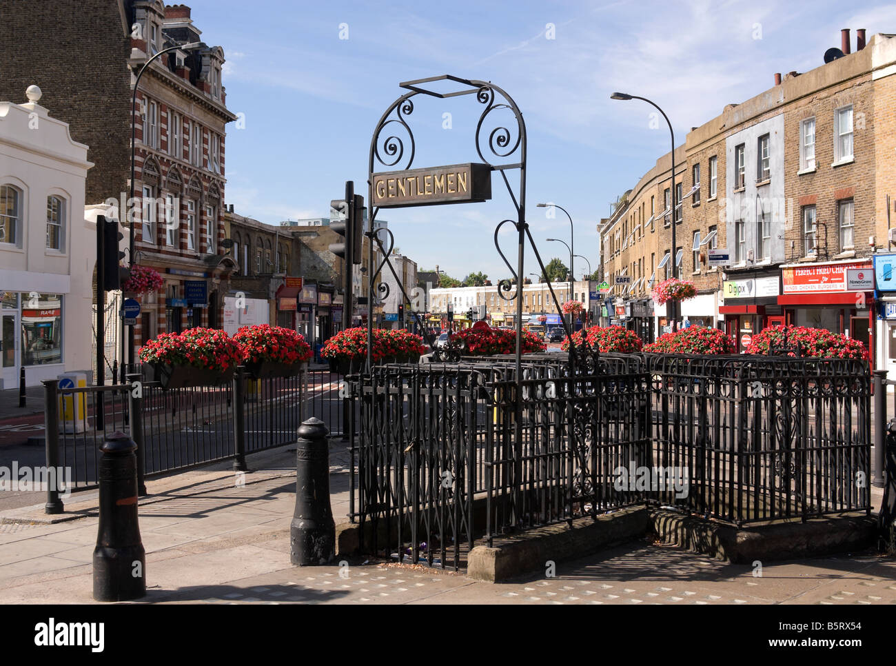 Public conveniences on a traffic island in New Cross Gate, London Stock Photo