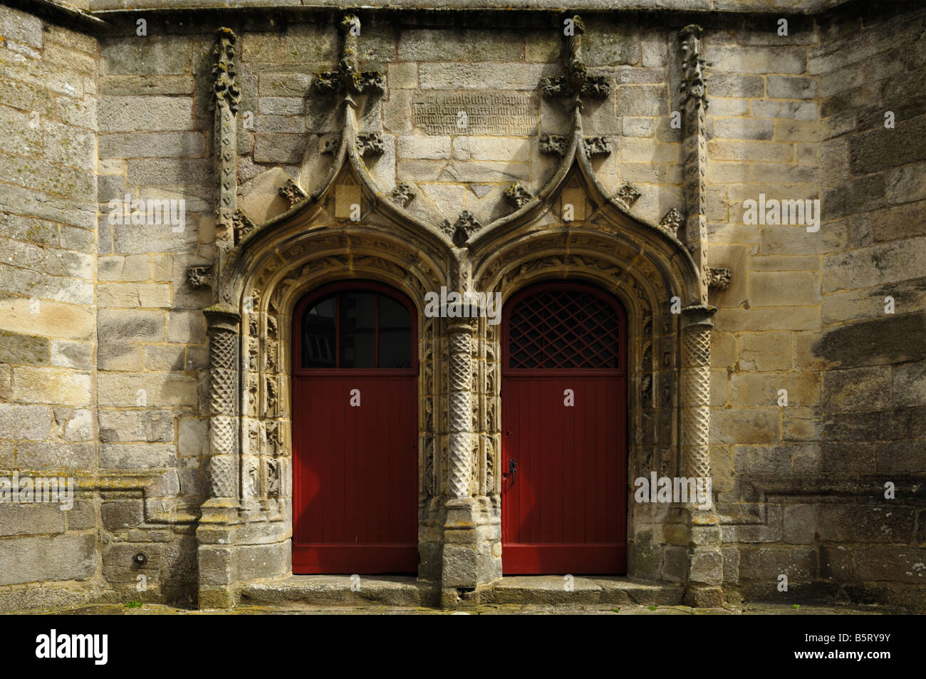 Entrance doors to the Notre-Dame-de-Joie basilica in the centre of Pontivy, Bretagne, France. Stock Photo