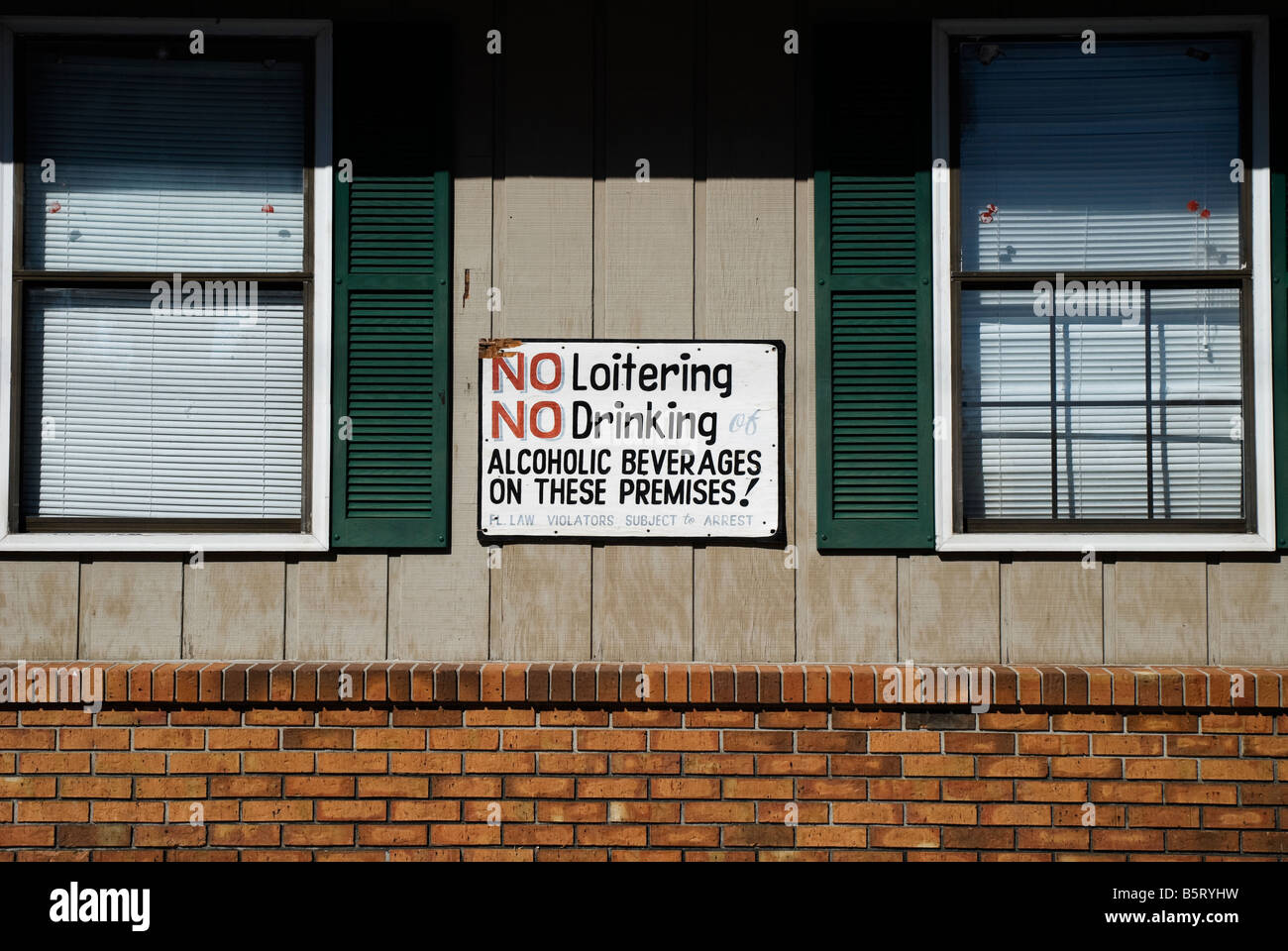 no drinking or loitering sign on side of building Lake City Florida Stock Photo