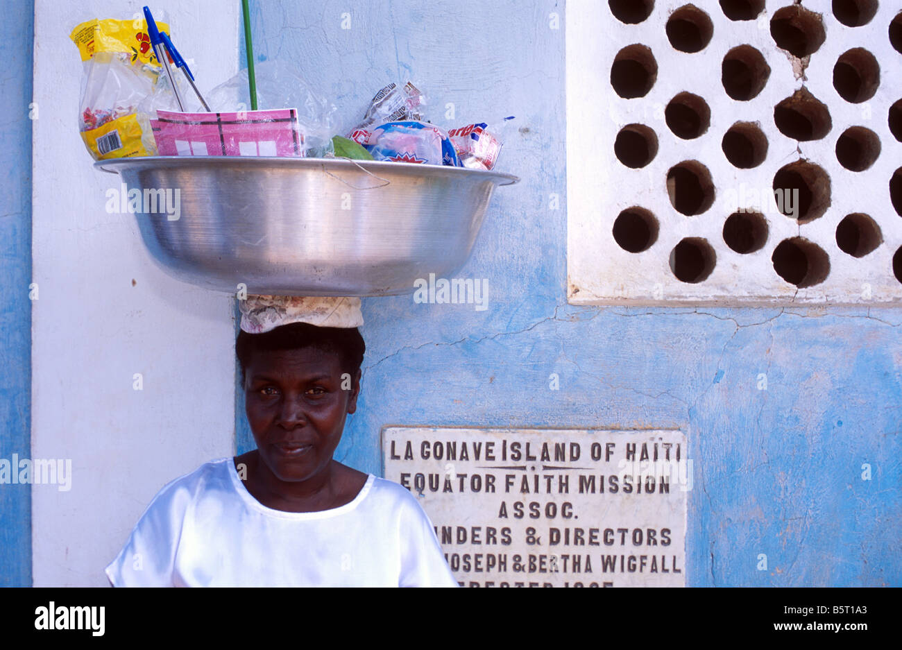 A woman carrying her produce for sale at the local market on the island