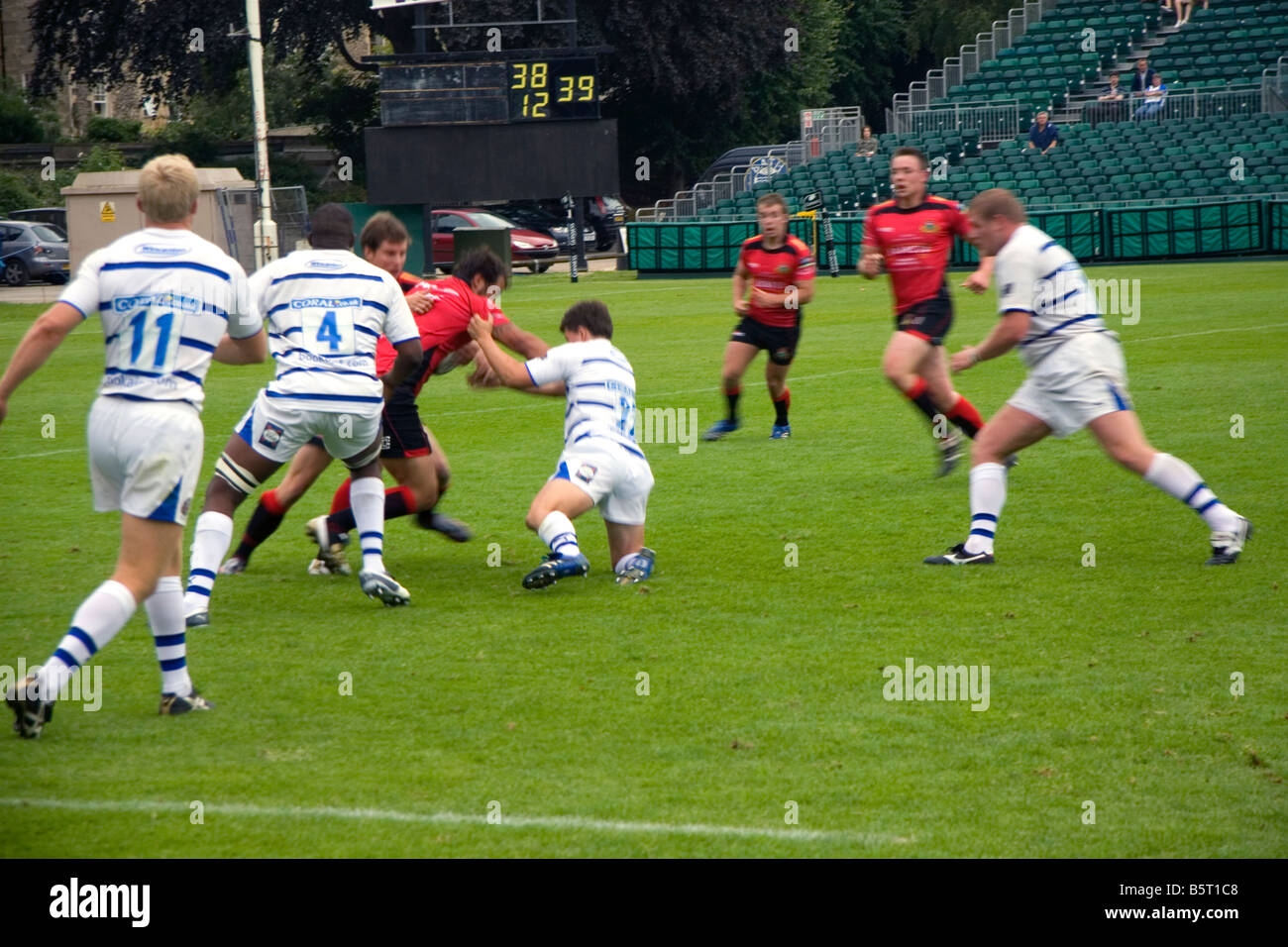 Men play a game of rugby in the city of Bath Somerset England Stock